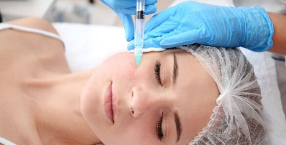 Cosmetologists perform facial skin rejuvenation procedures with plasma